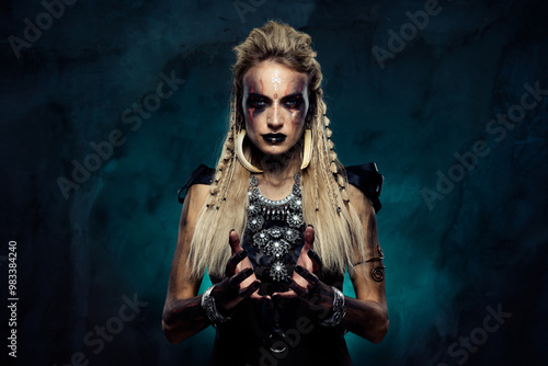 Fotografie Photo of dangerous lady wizard shaman in shield maiden tribe doing magic curse o