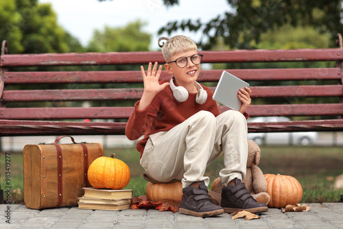 Cute boy with tablet comput...