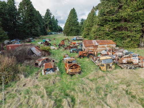 Abandoned and rusted classic cars  in the The historical Horopito Motor Wreckers - Smash Palace, near Raetihi, Manawatu-Wanganui, New Zealand. photo