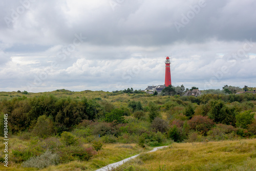 The red lighthouse north tower (Noordertoren) on the dune, Schiermonnikoog is a municipality and national park in the Northern Netherlands, One of the West Frisian Islands on the edge of the North Sea photo