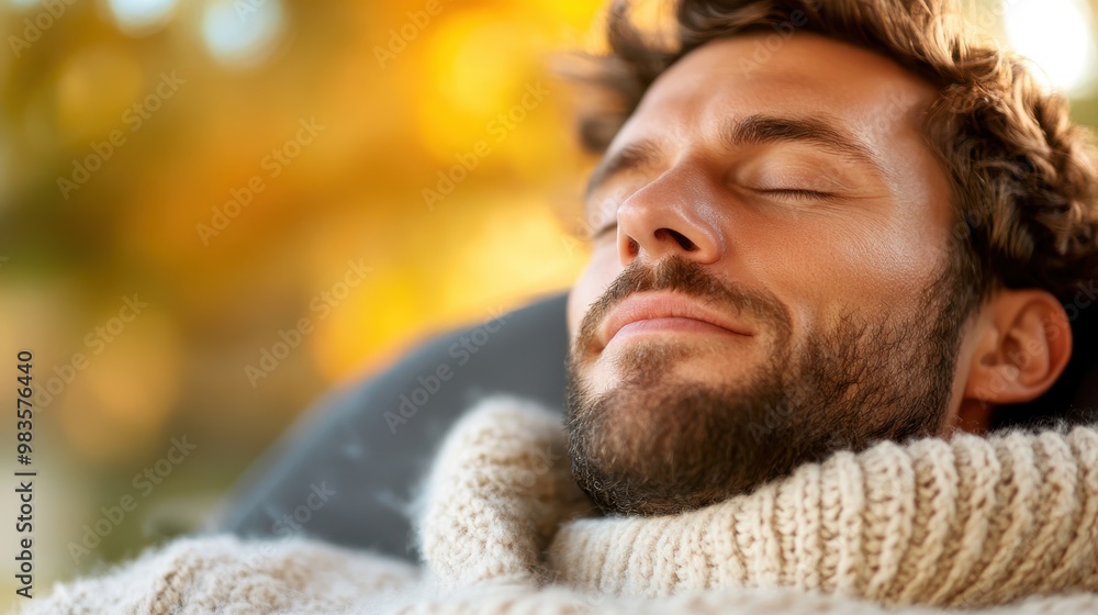 A person rests on a cozy, knitted blanket, with an autumnal background of warm hues and a peaceful atmosphere, capturing a moment of comfort and serenity. A person rests on a cozy, knitted blanket, with an autumnal background of warm hues and a peaceful atmosphere, capturing a moment of comfort and serenity.