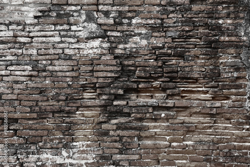 Obraz na płótnie Surface of the red brick wall is very old, damaged, dirty and covered with black mold. w salonie