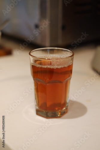 hot tea in glass on table. Selective focus and shallow depth of field.