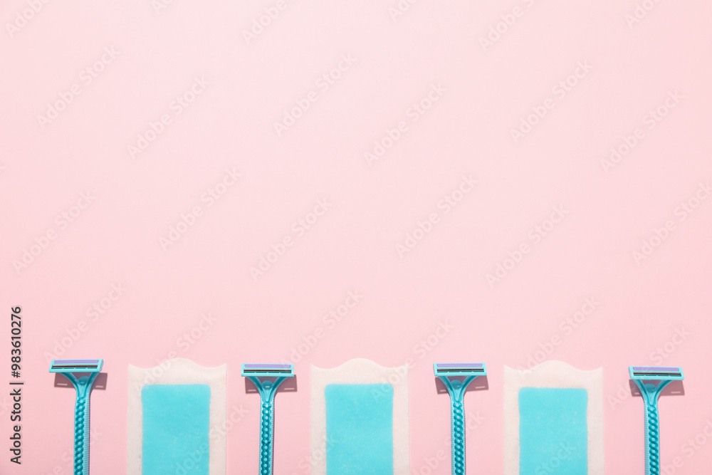 Razors for shaving with hair removal strips on a pink background Razors for shaving with hair removal strips on a pink background