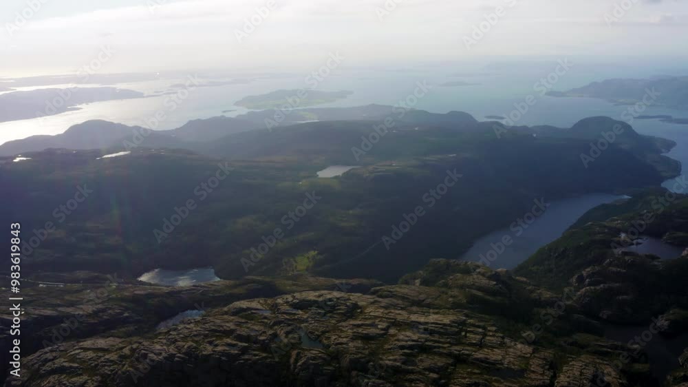 Explore Norway with Lysefjord mountain cliffs with water at background. Aerial view of dramatic landscape of scenic Scandinavian iconic fjord, ideal for nature tourism in Europe Explore Norway with Lysefjord mountain cliffs with water at background. Aerial view of dramatic landscape of scenic Scandinavian iconic fjord, ideal for nature tourism in Europe