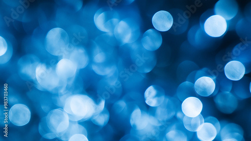 Abstract blue bokeh background with soft, blurred circles creating a calming atmosphere