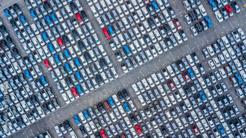 Obraz na płótnie Aerial view new cars lined up in the port for import and export, Top view of new cars lined up automobile factory global logistic import export, New cars logistic to dealership for sale. w salonie