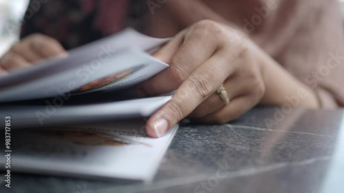 Wallpaper Mural women hand reading a food menu at cafe. Torontodigital.ca