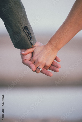 close up of a couple holding hands