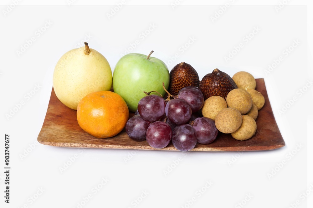 Assortment of exotic fruits isolated on white background. Close up of heap of fruit. Concept of healthy eating and dieting lifestyle. Assortment of exotic fruits isolated on white background. Close up of heap of fruit. Concept of healthy eating and dieting lifestyle.