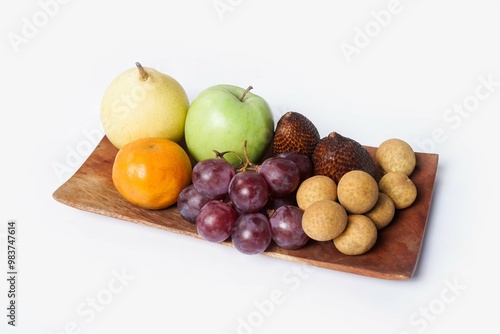 Assortment of exotic fruits isolated on white background. Close up of heap of fruit. Concept of healthy eating and dieting lifestyle. 