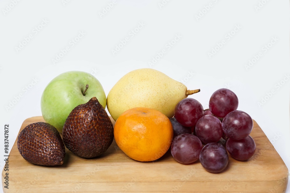 Assortment of exotic fruits isolated on white background. Close up of heap of fruit. Concept of healthy eating and dieting lifestyle. Assortment of exotic fruits isolated on white background. Close up of heap of fruit. Concept of healthy eating and dieting lifestyle.