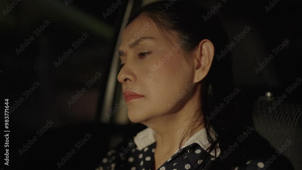 Close - up, woman asian driver being broken down with something terrible happened, emotional expression, depressed from health problems, economic crisis, brokenhearted concept. Close - up, woman asian driver being broken down with something terrible happened, emotional expression, depressed from health problems, economic crisis, brokenhearted concept.