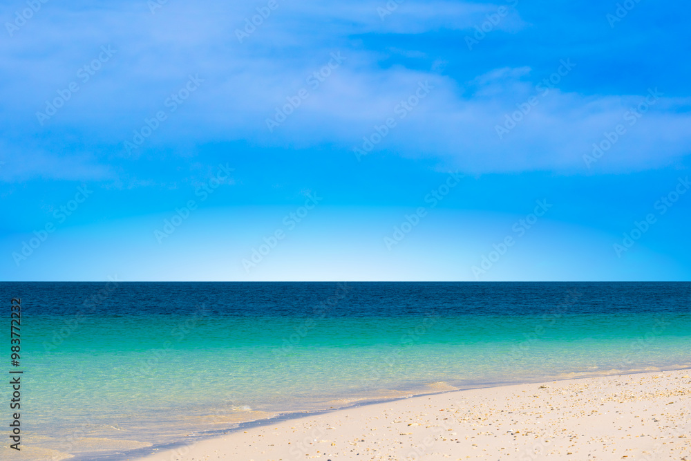 Nature of the beach and sea Summer with sunshine, sandy beaches, clear blue waters sparkling against the blue sky. On an island with good ecology and environment Background for summer vacation concept Nature of the beach and sea Summer with sunshine, sandy beaches, clear blue waters sparkling against the blue sky. On an island with good ecology and environment Background for summer vacation concept