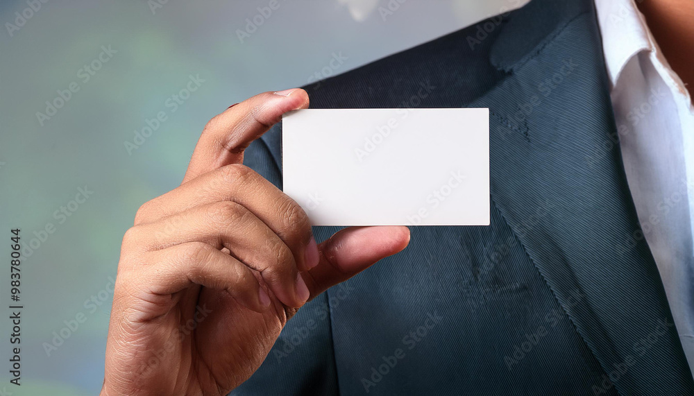 Obraz premium man in suit holding blank white business card mockup
