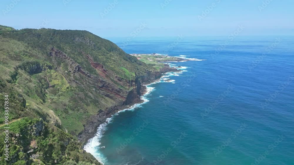 A stunning coastal view with cliffs and blue ocean under a clear sky during the day A stunning coastal view with cliffs and blue ocean under a clear sky during the day