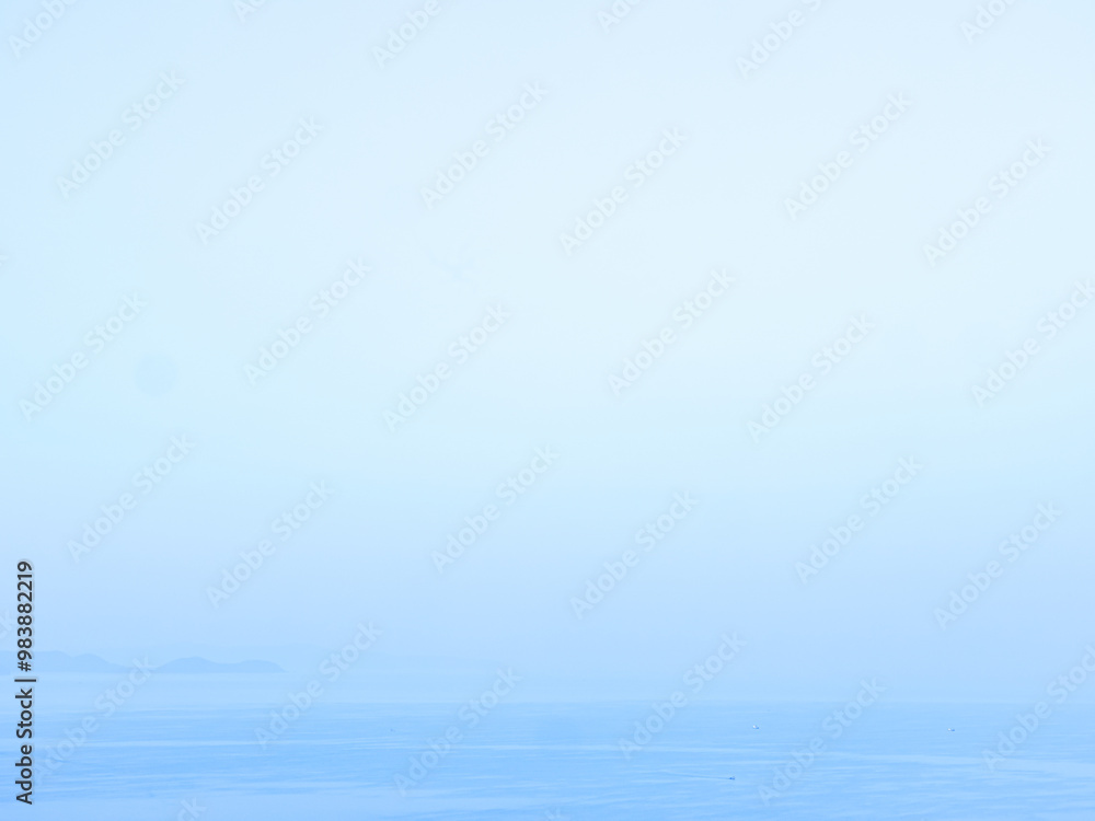 Obraz premium Serene Blue Horizon with Calm Water Surface