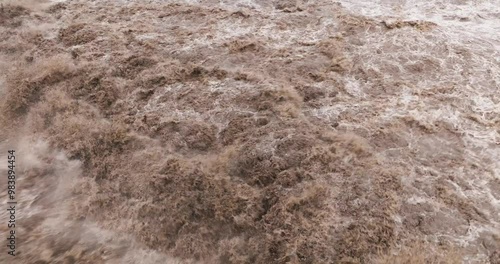 close up of flood water flowing in the river