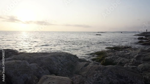 Sunset at ocean at Kappad Beach Kozhikode Kerala India in background of rocks video beautiful colorful sky  photo