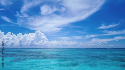 A beautiful scene of the blue ocean against the blue sky background. The ocean stretches out as far as the eye can see, with its surface glistening in the sunlight photo