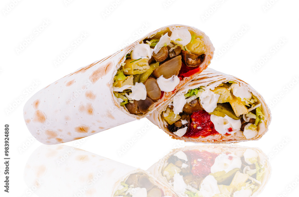 Two delicious vegetarian shawarma lying horizontally reflecting on white surface Two delicious vegetarian shawarma lying horizontally reflecting on white surface