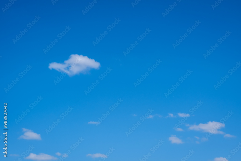 small white cumulus clouds in blue sky small white cumulus clouds in blue sky