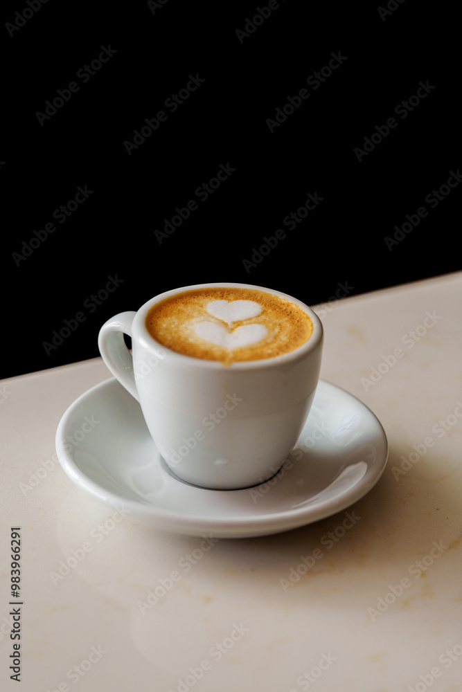 cup of coffee on black background macchiato cup of coffee on black background macchiato