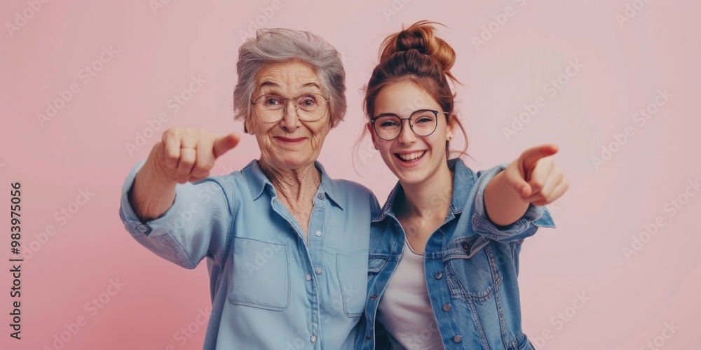 Two generations of women posing together for a photo with affectionate gestures. Two generations of women posing together for a photo with affectionate gestures.