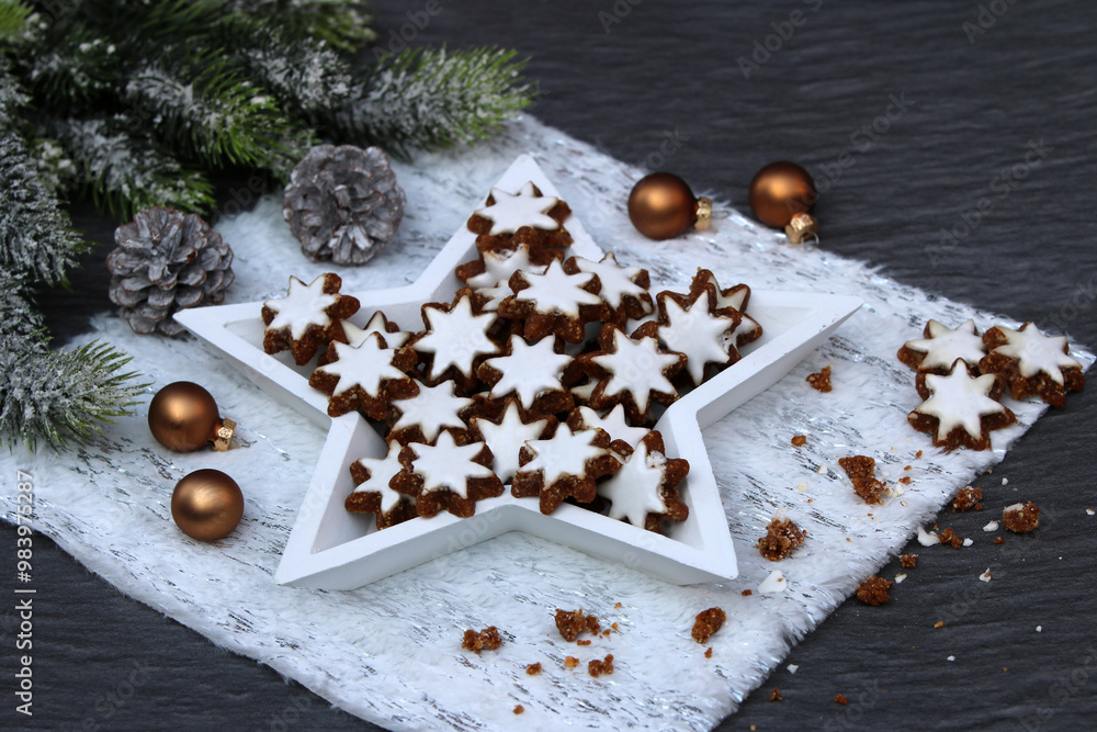 Cinnamon stars traditional German Christmas cookies on a plate. Cinnamon stars traditional German Christmas cookies on a plate.