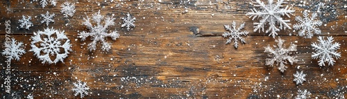 A beautifully rustic wooden table adorned with snowflakes, each one delicately detailed and frosted. The intricate snowflakes stand out against the rich wood grain, providing a seasonal touch. The photo