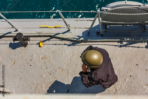 marines in white uniforms and officers on a battleship. combat scientists at sea. war in ukraine and black sea. old russian ships. military sailors talking on radios, watching other ships. military po photo