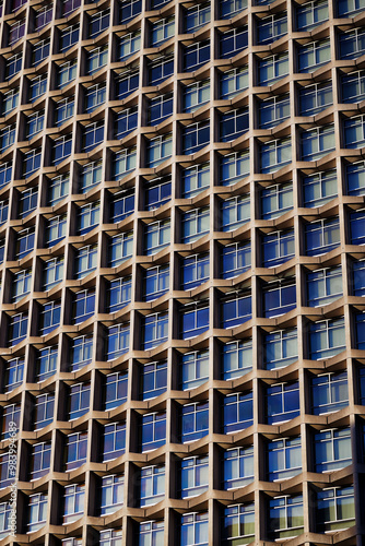 1960s modernism: post-war skyscraper; architectural symmetry, brutalist design, Centre Point skyscraper facade at Tottenham Court Road, Oxford Street, London UK, an iconic brutalist skyscraper photo