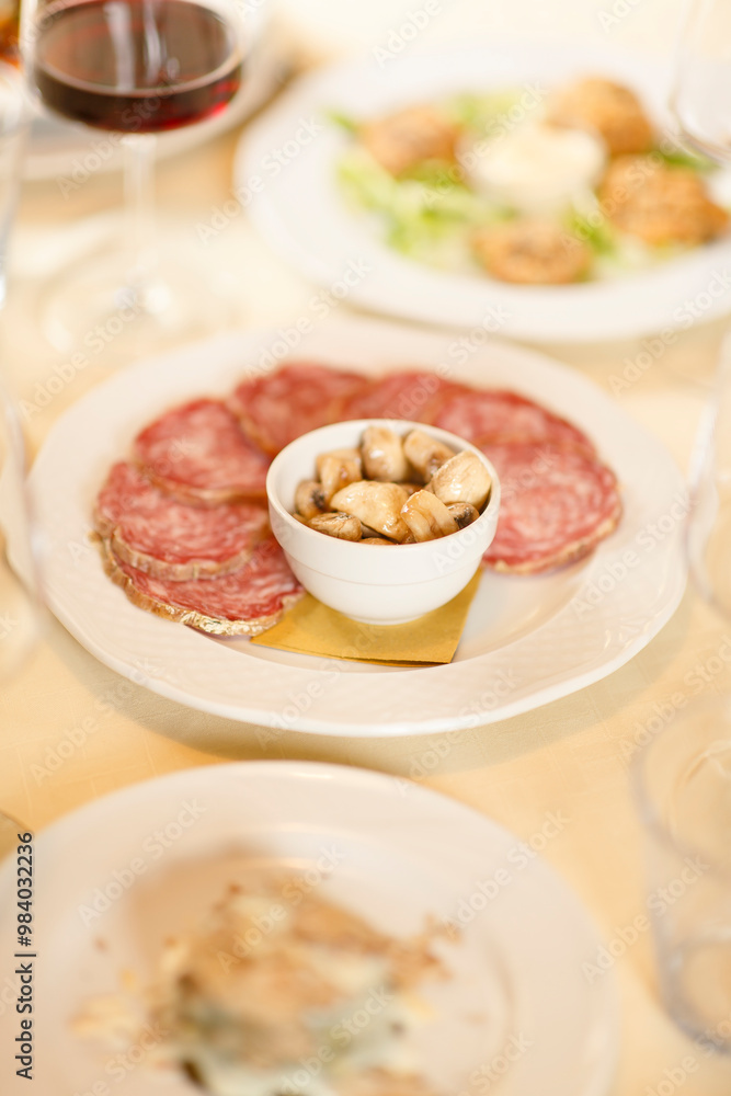 Close up on italian traditional northern food on a restaurant table. Many dishes are visible. Close up on italian traditional northern food on a restaurant table. Many dishes are visible.