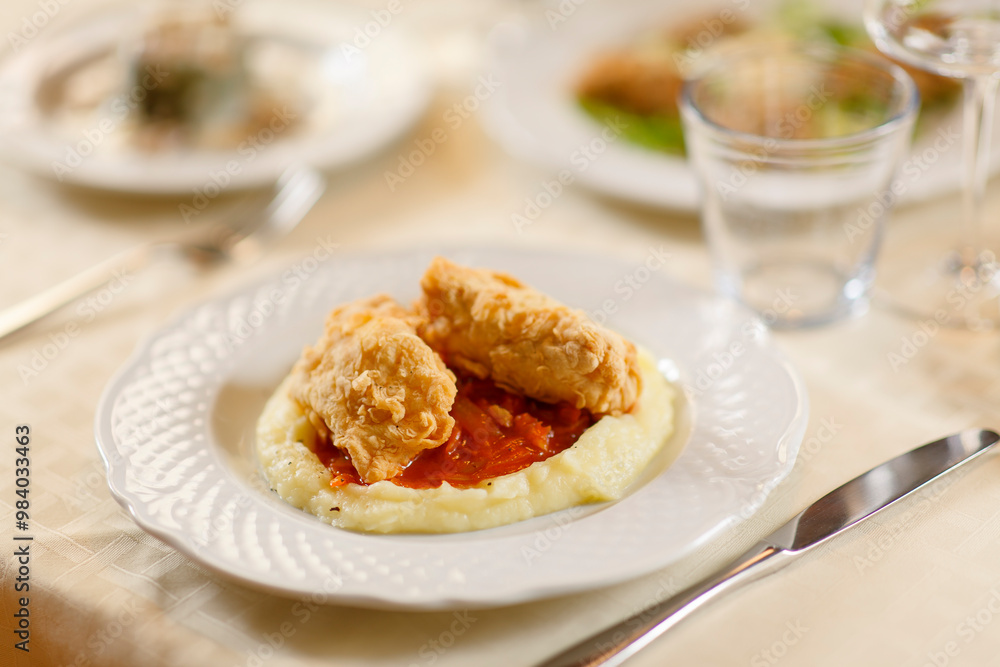Close up on italian traditional northern food on a restaurant table. Many dishes are visible. Close up on italian traditional northern food on a restaurant table. Many dishes are visible.