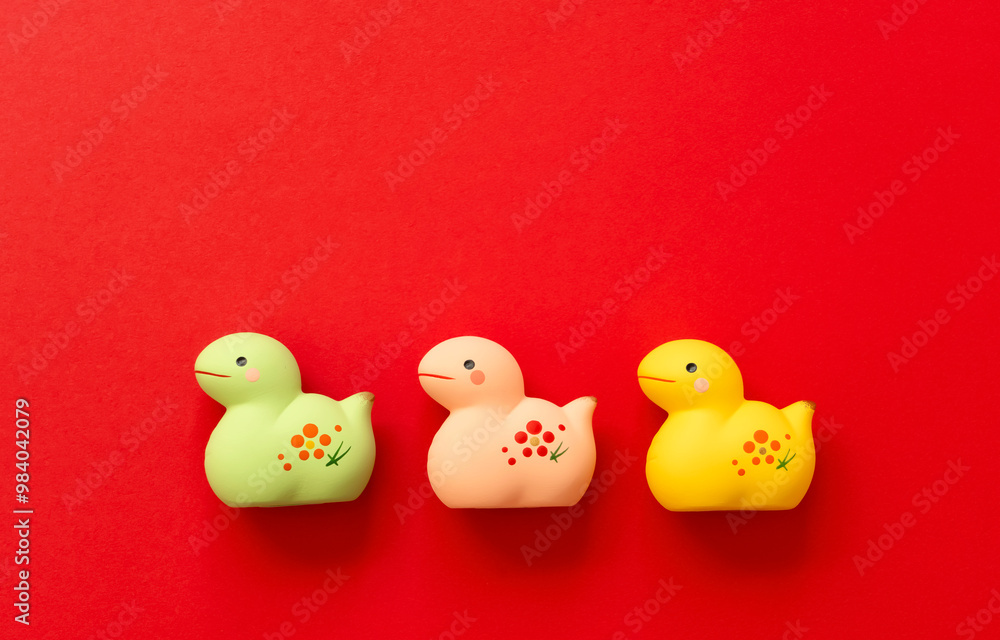 Japanese new year material. Zodiac Snake. Snakes ornament on the red background. 日本のお正月素材。干支の巳(ヘビ)。赤背景上の巳の置物 Japanese new year material. Zodiac Snake. Snakes ornament on the red background. 日本のお正月素材。干支の巳(ヘビ)。赤背景上の巳の置物