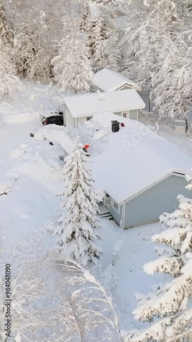 Wallpaper Mural Panoramic drone shot circling a man shoveling snow a house roof with solar panels Torontodigital.ca