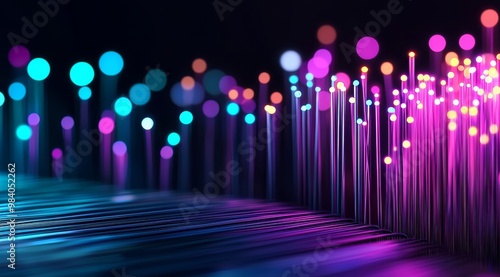 Close up of glowing fiber optic cables against dark background photo