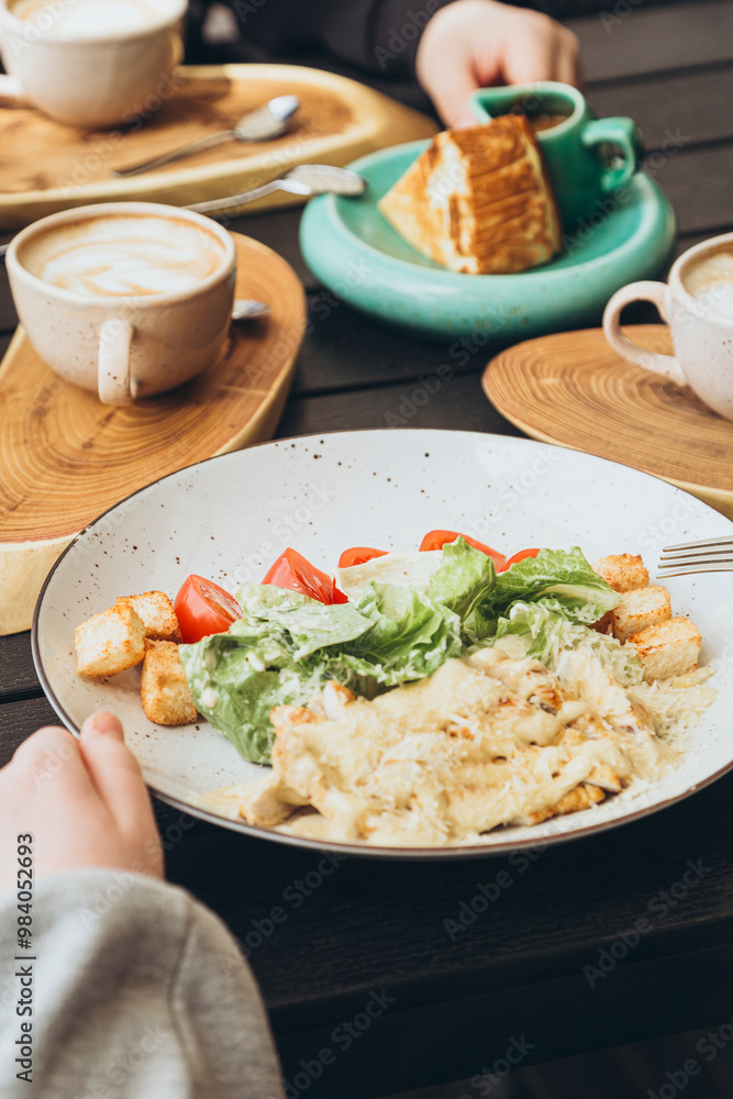 Casual breakfast with coffee and caesar salad at cafe