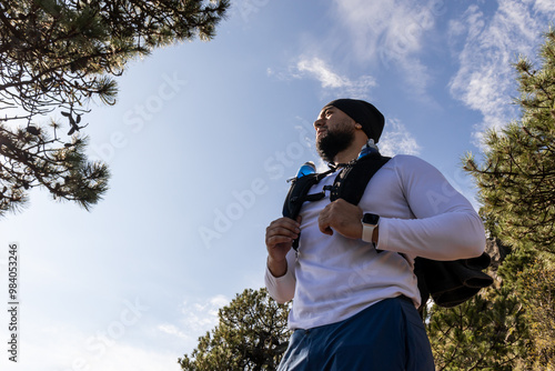 Hiker contemplating nature on sunny day photo