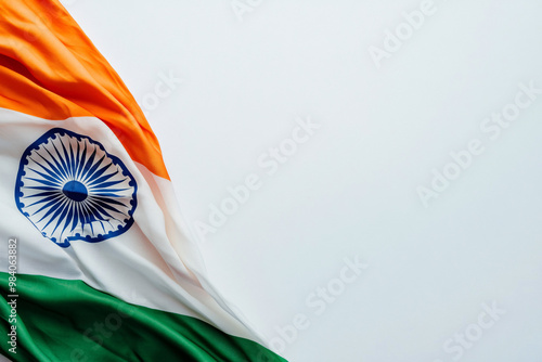 waving Indian flag with saffron white and green colors and a blue Ashoka Chakra on a bright plain background