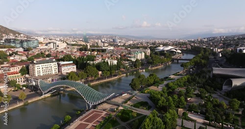 Fixed Aerial View of Rike Park, Bridge of Peace, Kura River. Summer Sunrise photo