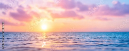 beautiful sunset sky and ocean nature background in pink hue