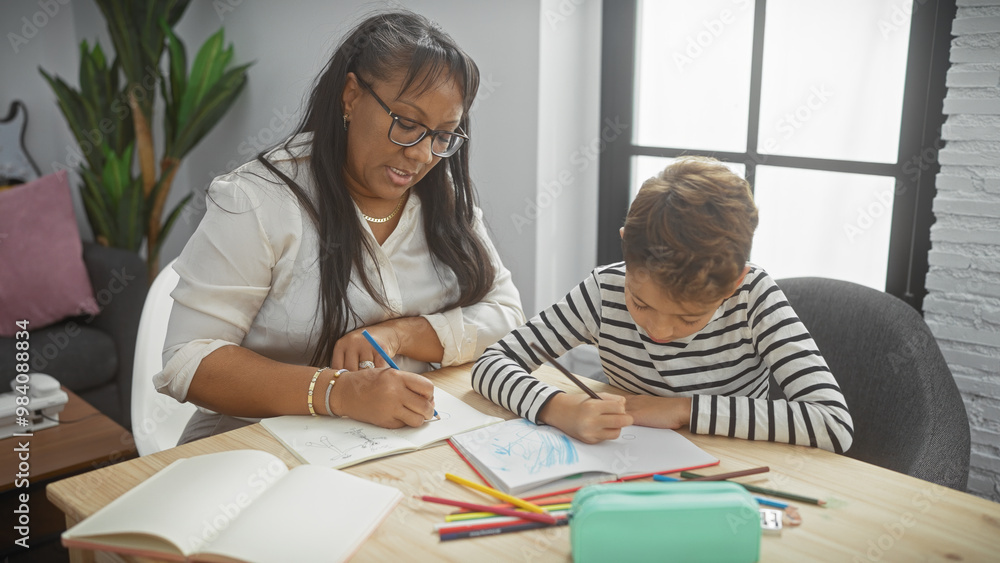 A woman and boy bonding over drawing together in a cozy living room A woman and boy bonding over drawing together in a cozy living room