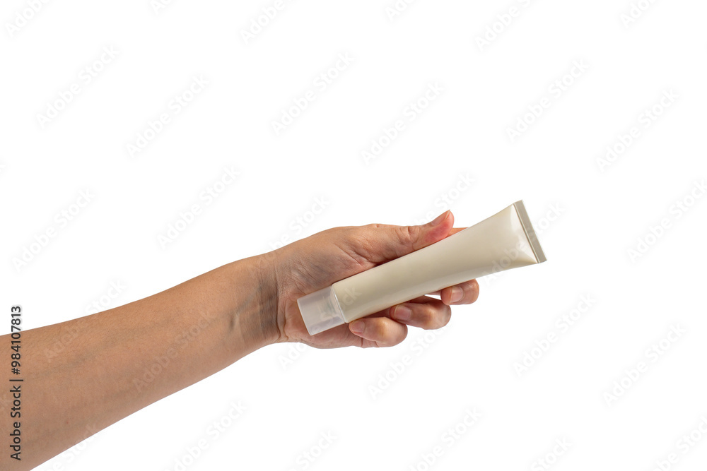 Plastic white tube for cream or lotion. Skin care or sunscreen cosmetic with hand on transparent background. Plastic white tube for cream or lotion. Skin care or sunscreen cosmetic with hand on transparent background.