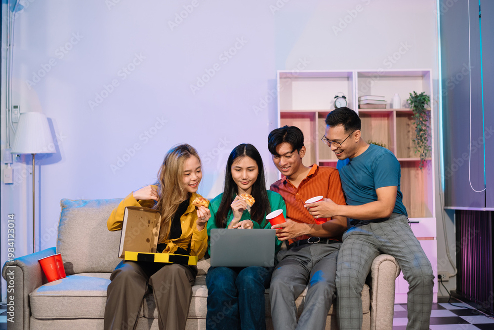 Young Asian Friends Celebrating with Laughter and Food at a Modern Evening Party