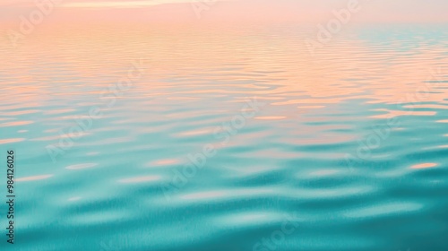 A calm, pastel-colored sky reflected in the surface of a quiet lake at sunset, with soft ripples in the water