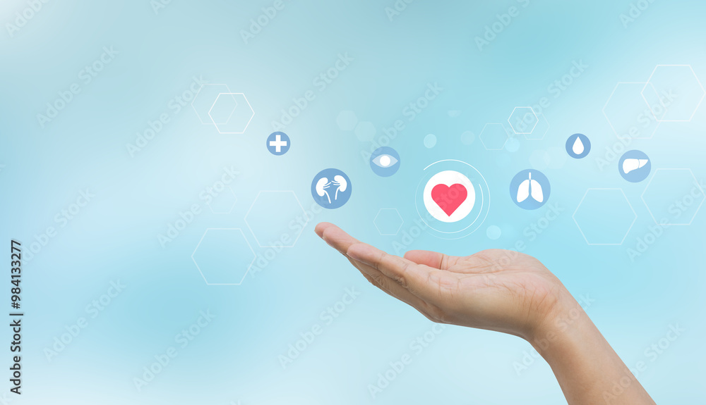 close up young woman hand gesture and show about internal organ donation of human cell on blue background for kindness of living and medical nonprofit concept close up young woman hand gesture and show about internal organ donation of human cell on blue background for kindness of living and medical nonprofit concept