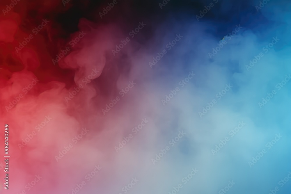 Naklejka premium Red and blue smoke clouds blending together on a dark background, creating a dramatic and vibrant effect.