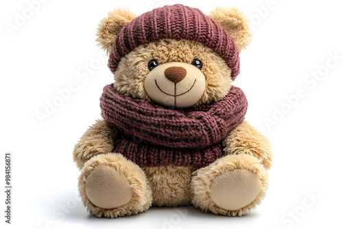 a stuffed bear wearing a hat and scarf