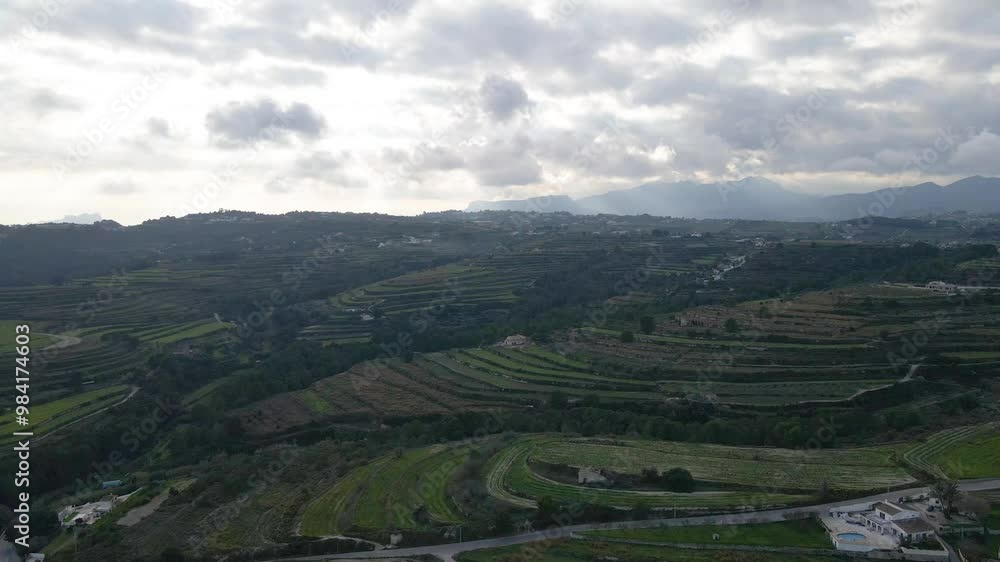 Aerial overview of the stepped landscape in Extremadura, Spain, featuring layered terrain with lush vegetation and open fields Aerial overview of the stepped landscape in Extremadura, Spain, featuring layered terrain with lush vegetation and open fields